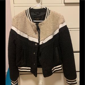 A Sherpa Varsity jacket